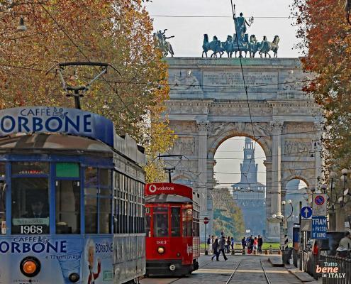 Arco della Pace Milan with tram • m24o A traditional tram near Sempione Park, Arco della Pace (Porta Sempione) and Castello Sforzesco in the background, Milan, Italy.