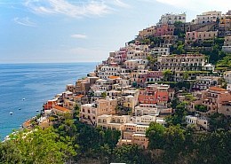 The houses of Positano nestle tightly against the steep coast • m24o The houses of Positano nestle tightly against the steep coast