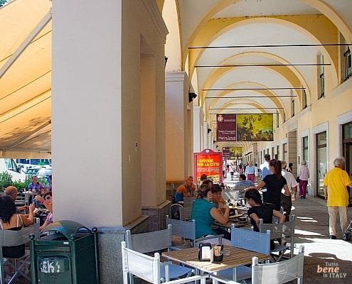 Arcades in Asti in Piedmont, Italy • m24o Strolling and bars in the arcades in Asti