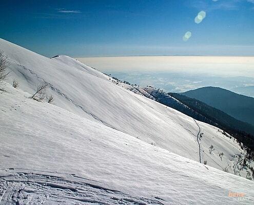 Winter hiking at the Lake Como with view to the Alps • m24o Winter hiking at the Lake Como with view to the Alps