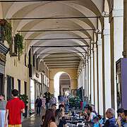 Cremeria Ghigo Turin Arcades Cafe Pastisceria Via Po • m24o Pedestrians walk under the historic arcades of Turin past the outdoor seating of the traditional Cremeria Ghigo cafe.