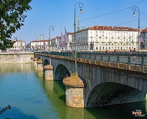 Turin Po River Bridge Ponte Vittorio Emanuele I Mole Antonelliana • m24o View over the green Po River towards the stone bridge Ponte Vittorio Emanuele I in Turin with the Mole Antonelliana in the background.