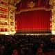In the occupied auditorium of La Scala, visitors expect the opera performance