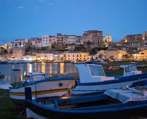 On your Italy Trip to Sicily you might want to visit Castellammare del Golfo near Trapani in the West with its medieval fortress in the harbour