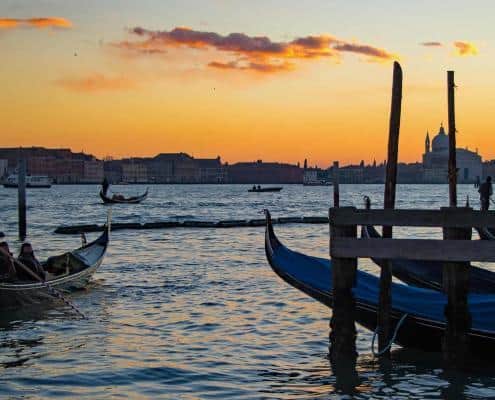 Romantic gondola ride in Venice on the Canal Grande at sunset