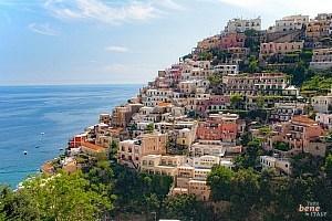 The houses of Positano nestle tightly against the steep coast • m24o The houses of Positano nestle tightly against the steep coast