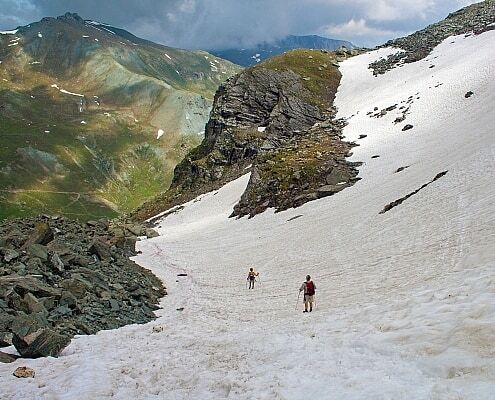 Hiking at the Monviso in Piedmont with snow in summer