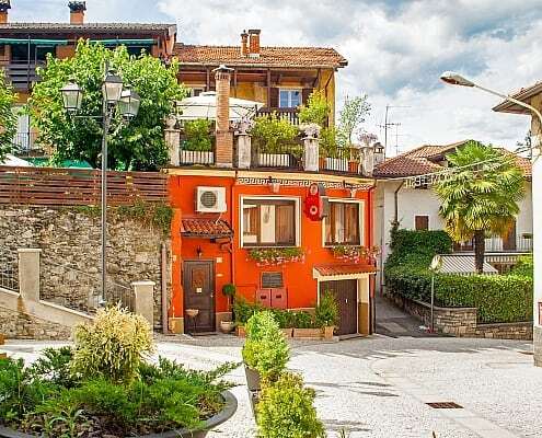 Lago Maggiore, Baveno, location Romanico with beautiful red house in the village in summer
