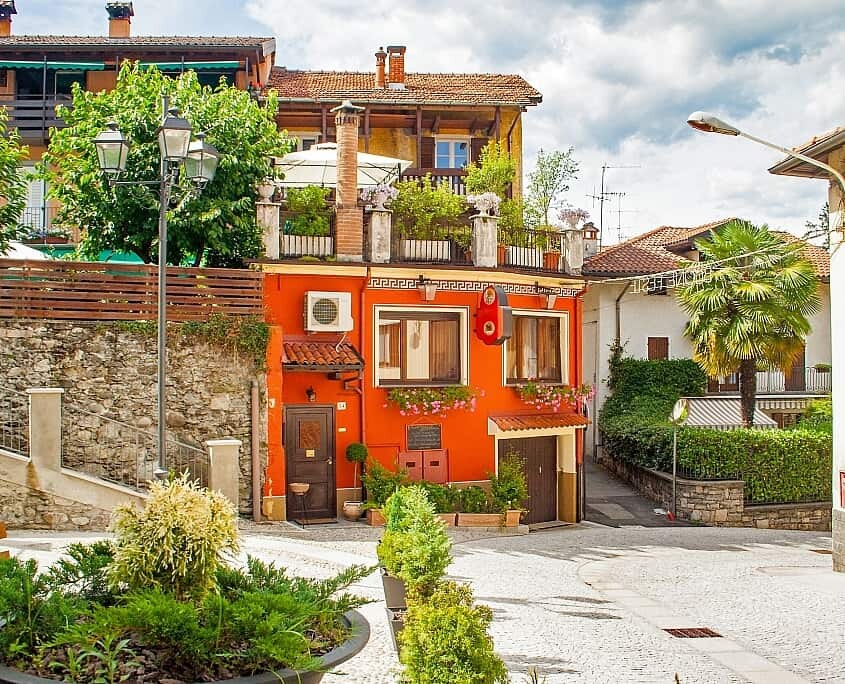 Lago Maggiore, Baveno, location Romanico with beautiful red house in the village in summer