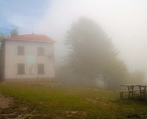 Hiking at the Apennines to Rifugio Monte Antola in fog, Piedmont, italy