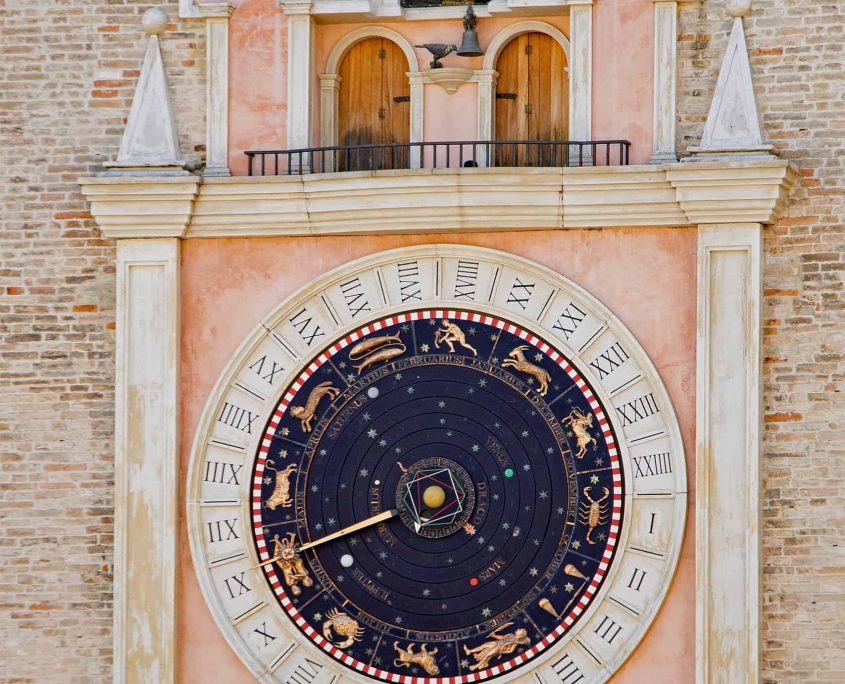 Astronomical Clock on the Torre Civica, Macerata • m24o Close-up of the astronomical clock on the Torre Civica in Macerata, showing the golden planetary dials and the mechanical figures above.